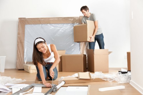 Family moving furniture into a secure Forestgate storage facility