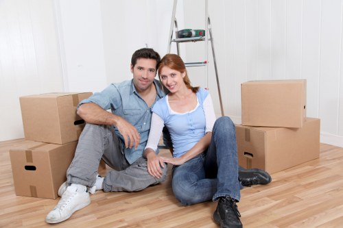 Family organizing belongings for mobile self storage in Forestgate
