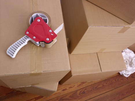 Organized short-term storage unit in Forestgate with labeled boxes and furniture